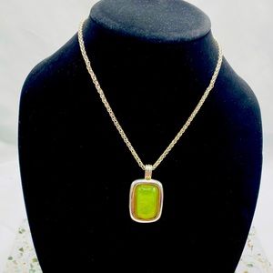 Silver necklace with a green pendant